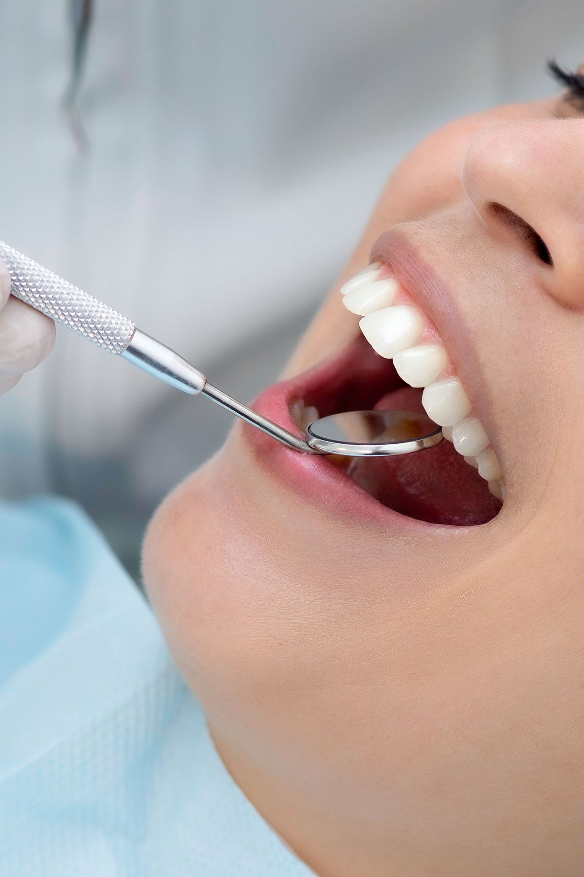 A patient reviewing treatment costs with the America Dentistry team
